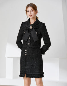 Black tweed two piece with bow and brooch