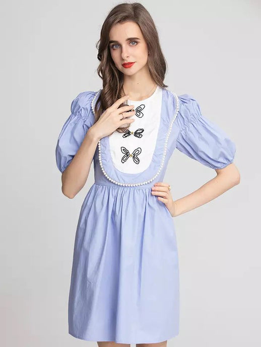 Butterfly and pearl oversized bib mini dress