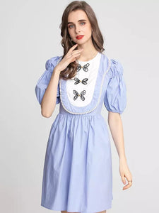 Butterfly and pearl oversized bib mini dress