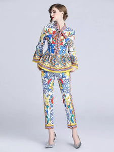 Exuberant pattern peplum top and trouser set