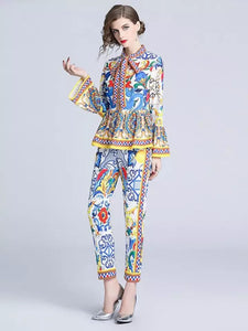 Exuberant pattern peplum top and trouser set