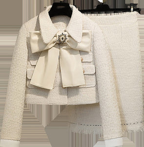 The Cream tweed two piece with bow and brooch