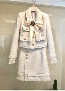 The Cream tweed two piece with bow and brooch