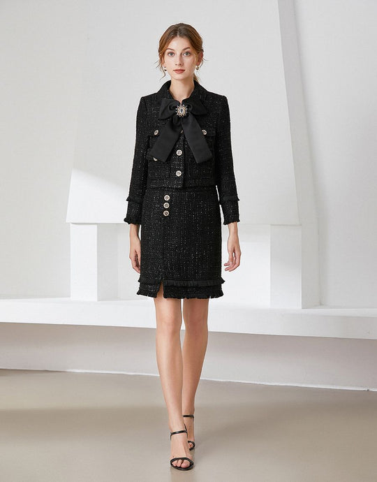 Black tweed two piece with bow and brooch